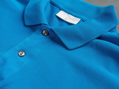 Blue cotton polo t-shirt texture close up. Men's fashion