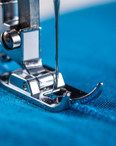 Closeup of sewing machine and fabric