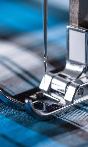 Close-up of sewing machine and fabric