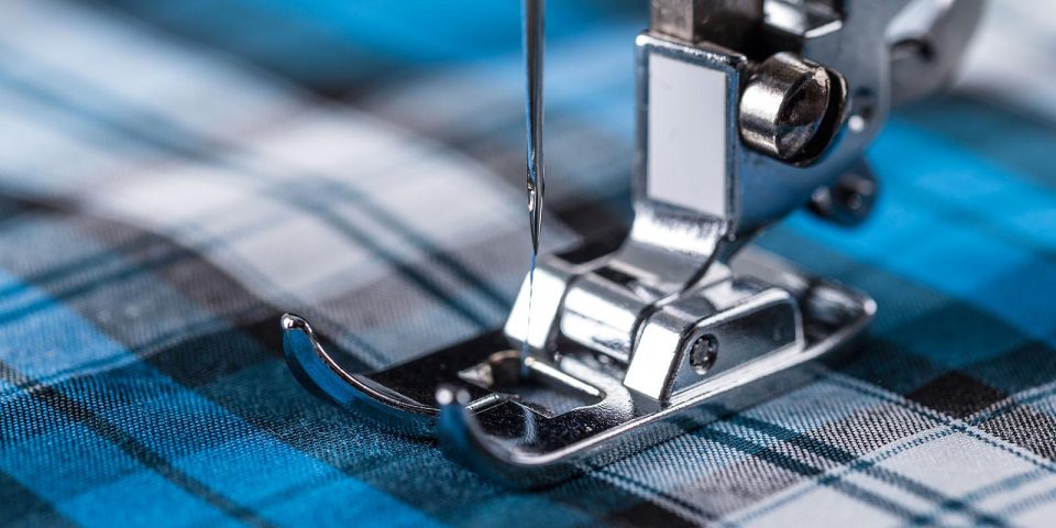Close-up of sewing machine and fabric